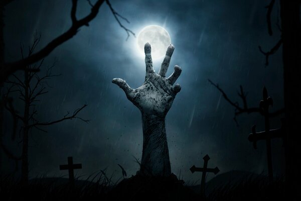 Halloween. La mano del hombre muerto en el cementerio