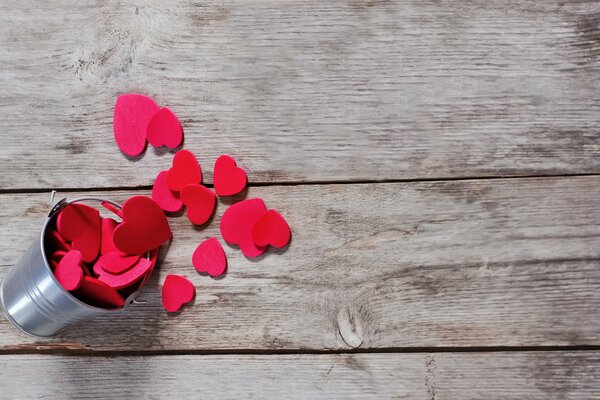 Cute red hearts in a small bucket