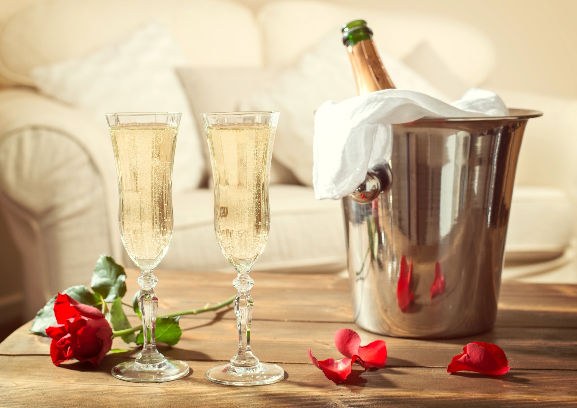 champagne glasses a bottle holiday rose red flower petals table