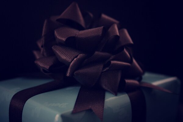 A gift with a bow in the dark is a surprise to your beloved