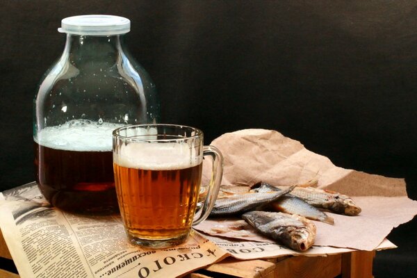 Beer with dried fish on the table