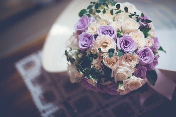 Wedding bouquet of purple and beige roses