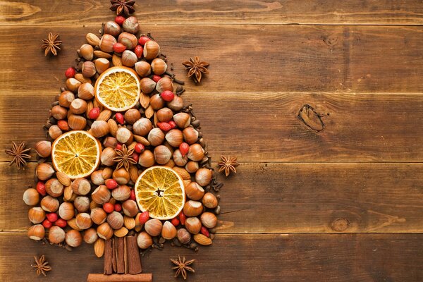 Christmas tree made of nuts and oranges