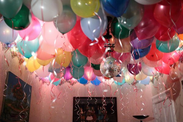 Party with balloons and disco ball