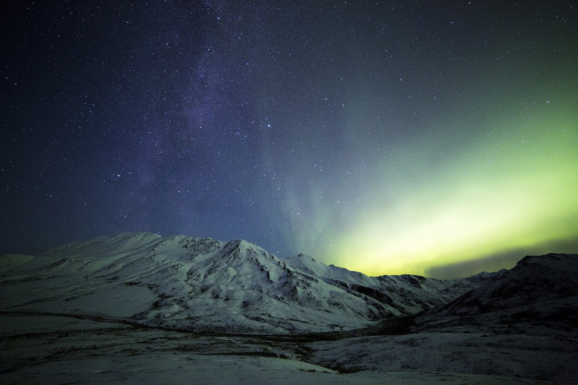 mountain snow night northern lights milky way