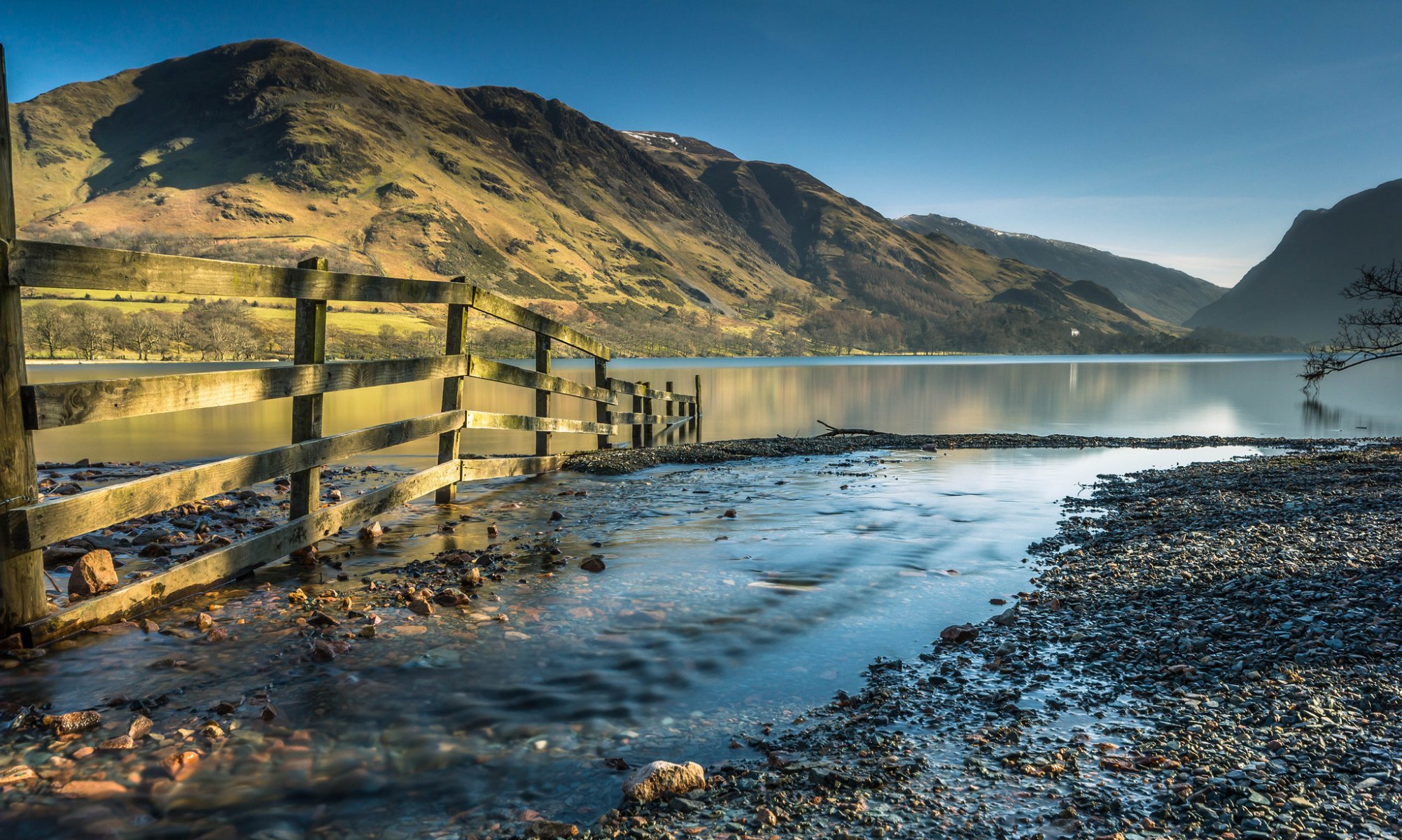 mountain lake fence creek