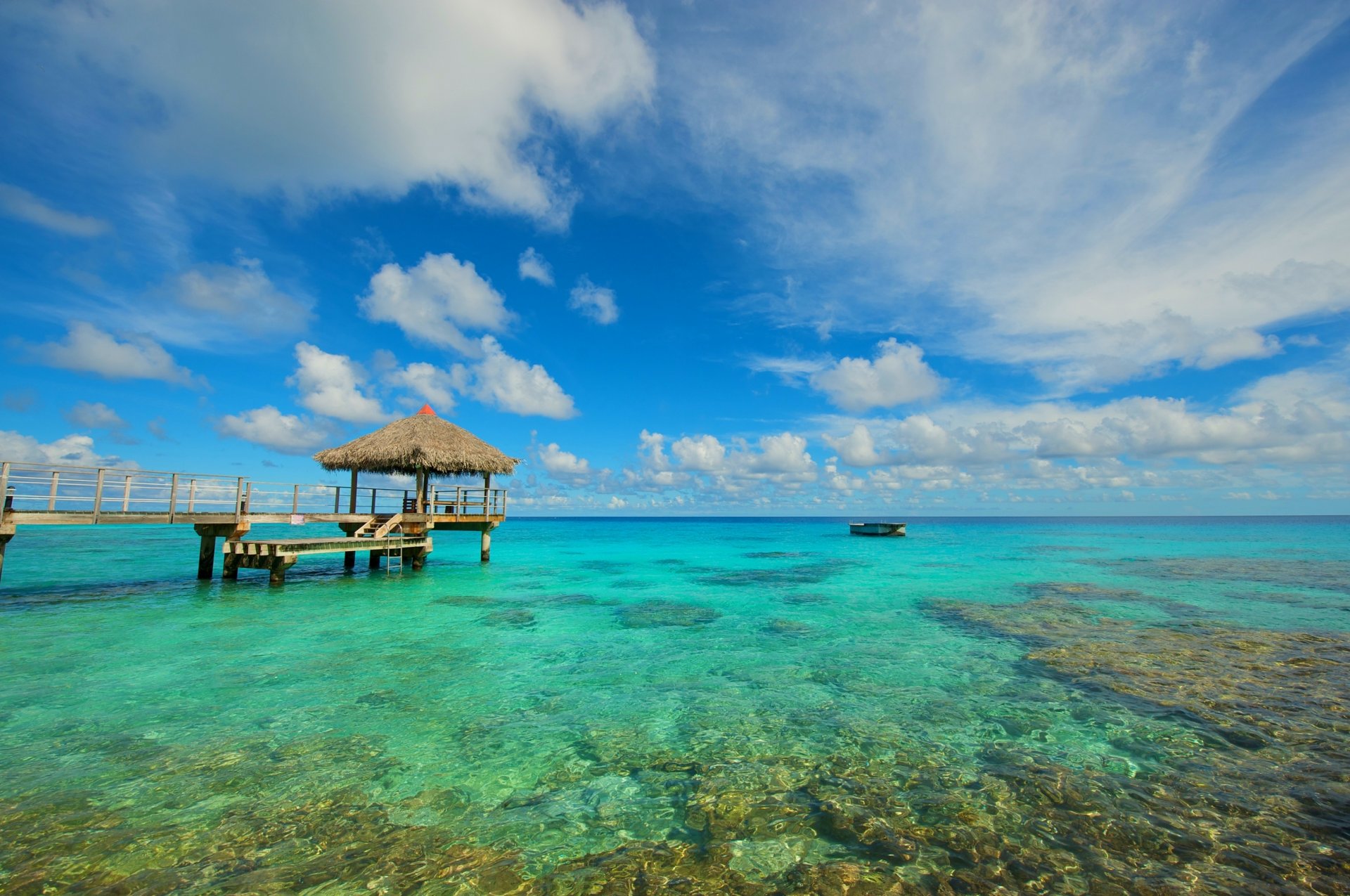 océano agua piedras muelle barco cielo nubes