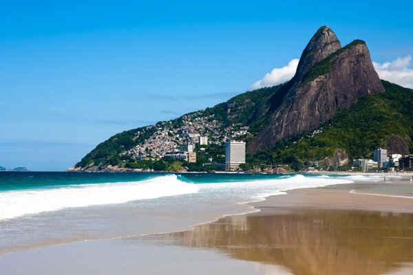 Brazilian coast in clear weather against the backdrop of mountains