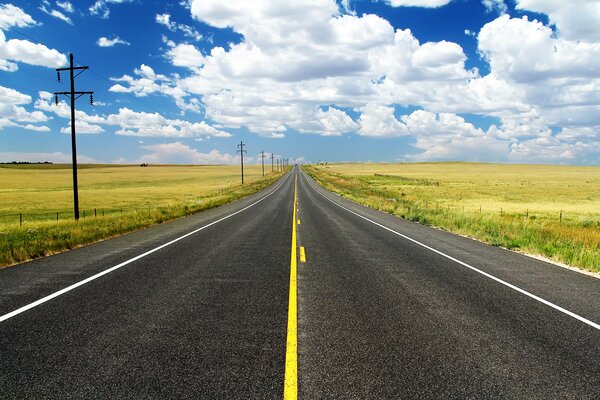 A straight road in the yellowing steppe