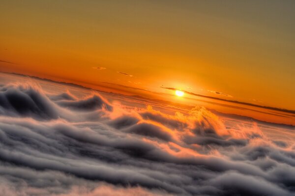 Fiery sunset in the sky in the clouds