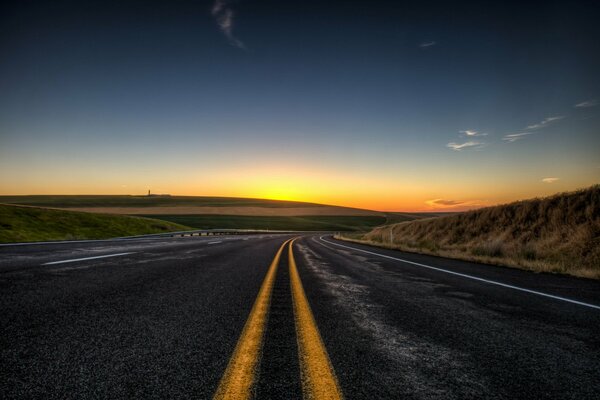 Morning landscape with a road at dawn