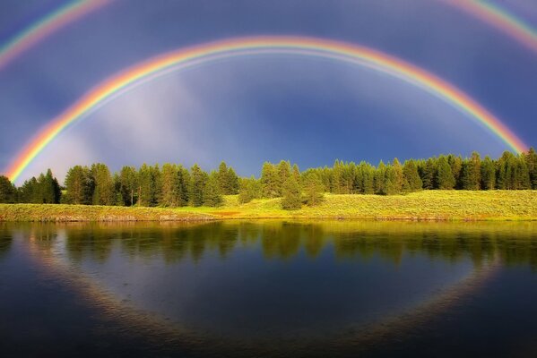 Incredibly beautiful rainbow over the lake