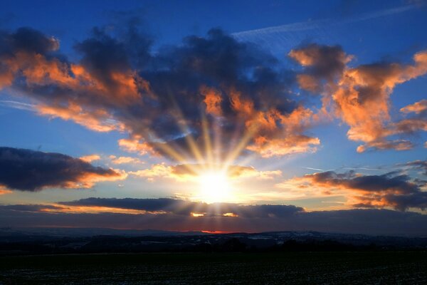 The rays of the sun piercing the clouds