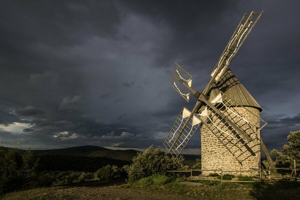 Landscape with a mill. Evening sky