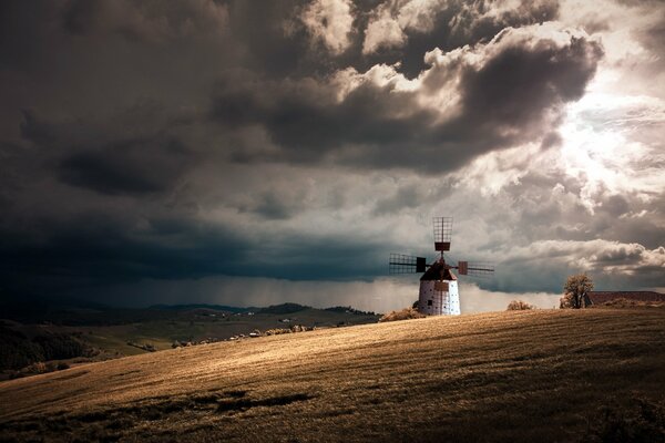 A field in the middle of a mill in the rain