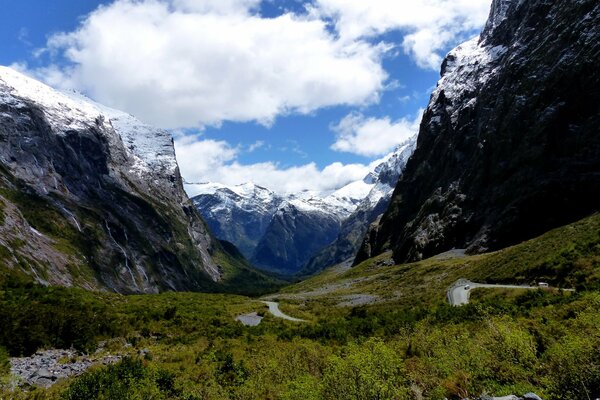 White clouds in snow-capped mountains