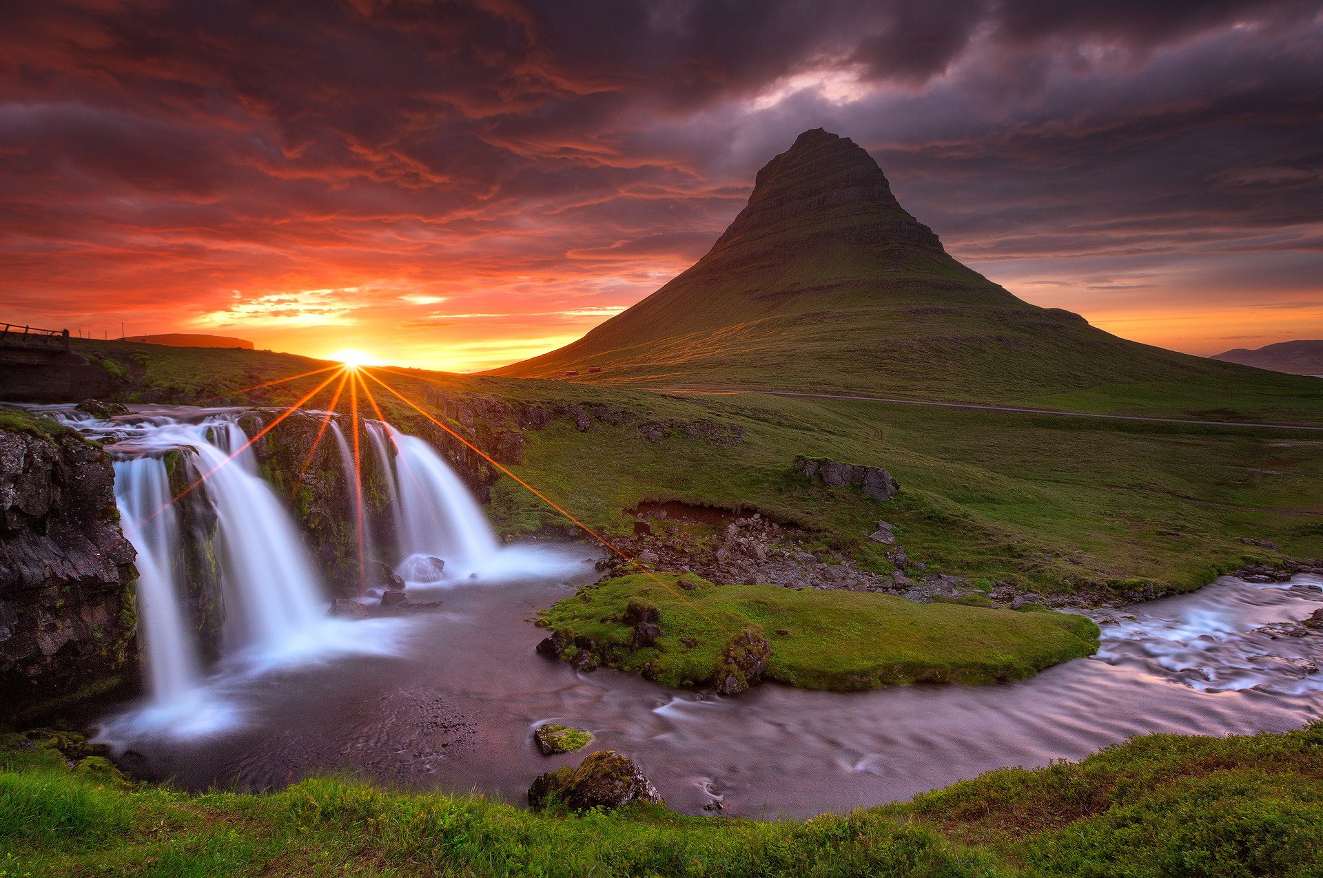 iceland kirkjufell mountain volcano rock waterfall night sky clouds sun rays sunset