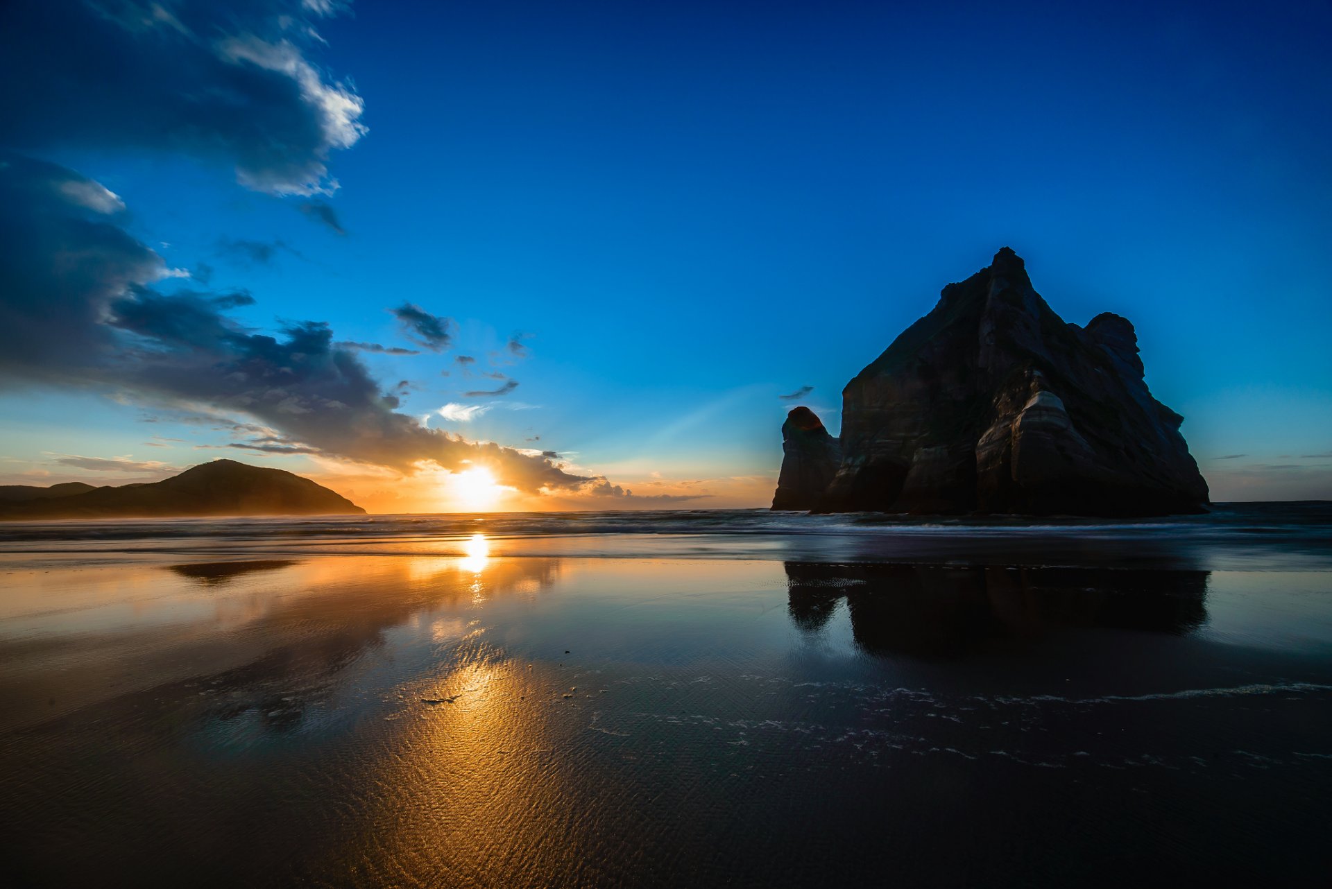 nz playa wharikiri playa roca amanecer arena nueva zelanda