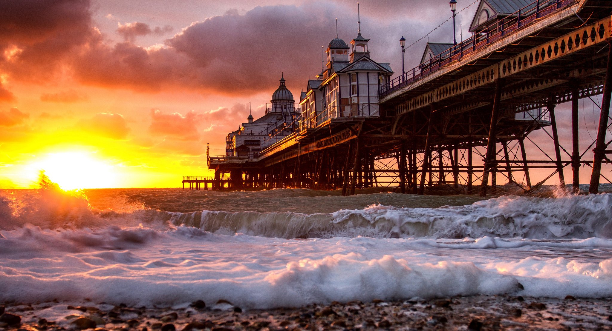 dawn beach pier building ocean wave