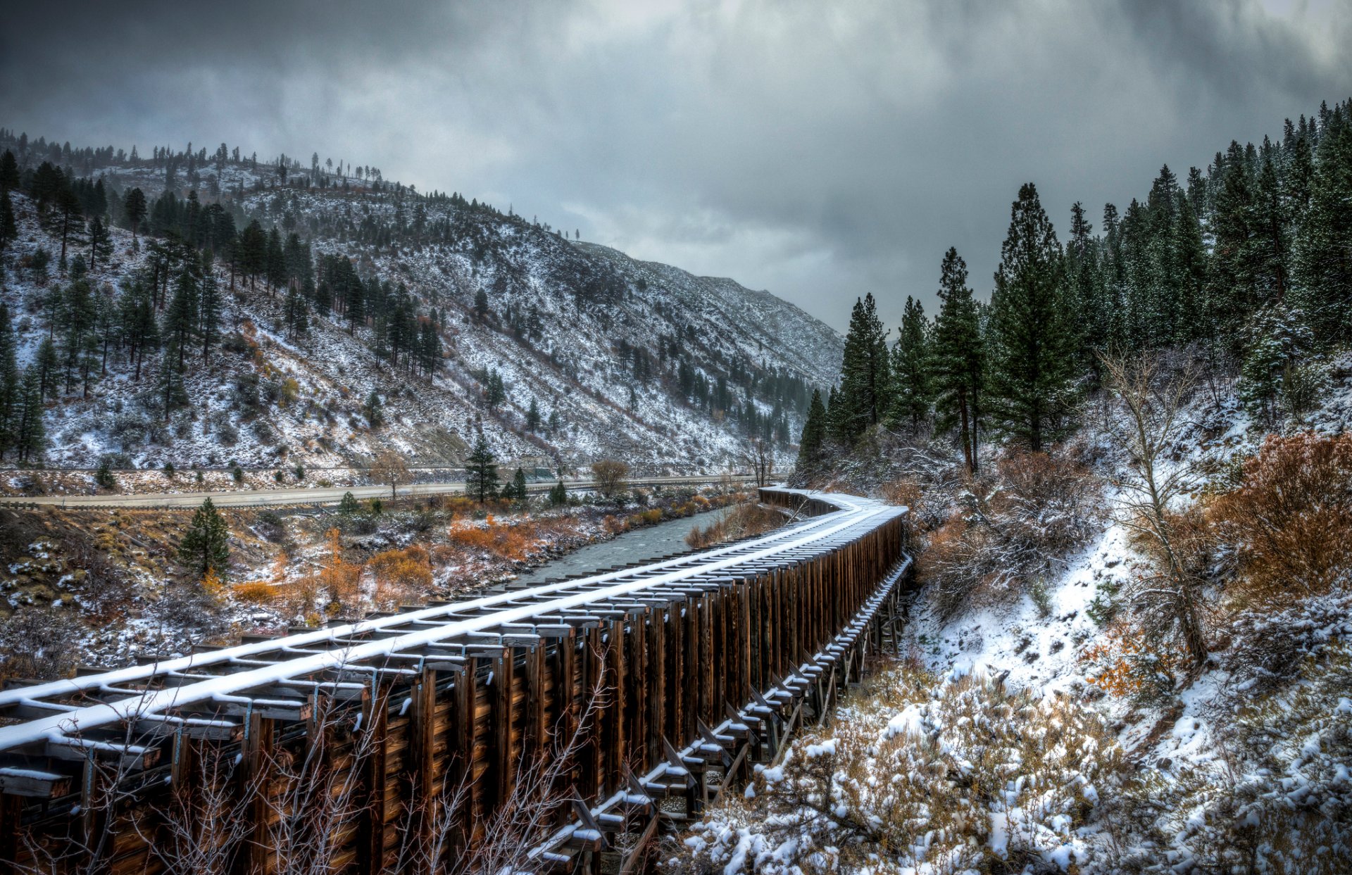 road rails autumn snow tree river mountain