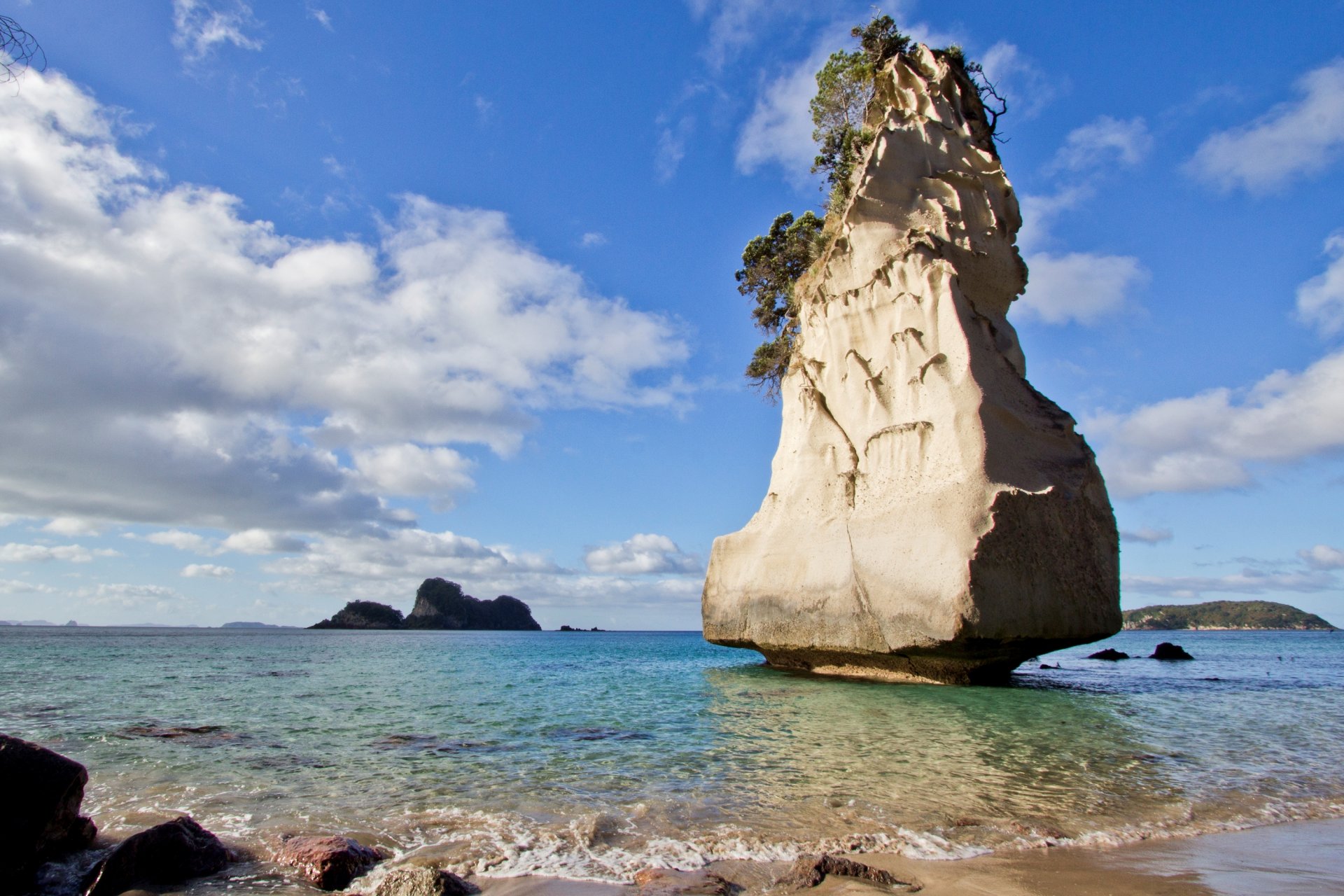 ea beach sand stones rock sky cloud