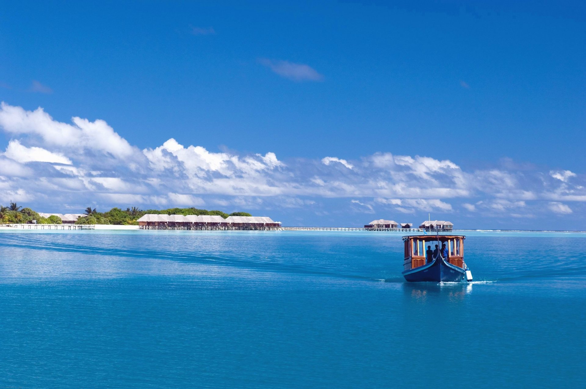 himmel meer ozean insel malediven boot boot palmen wolken bungalow