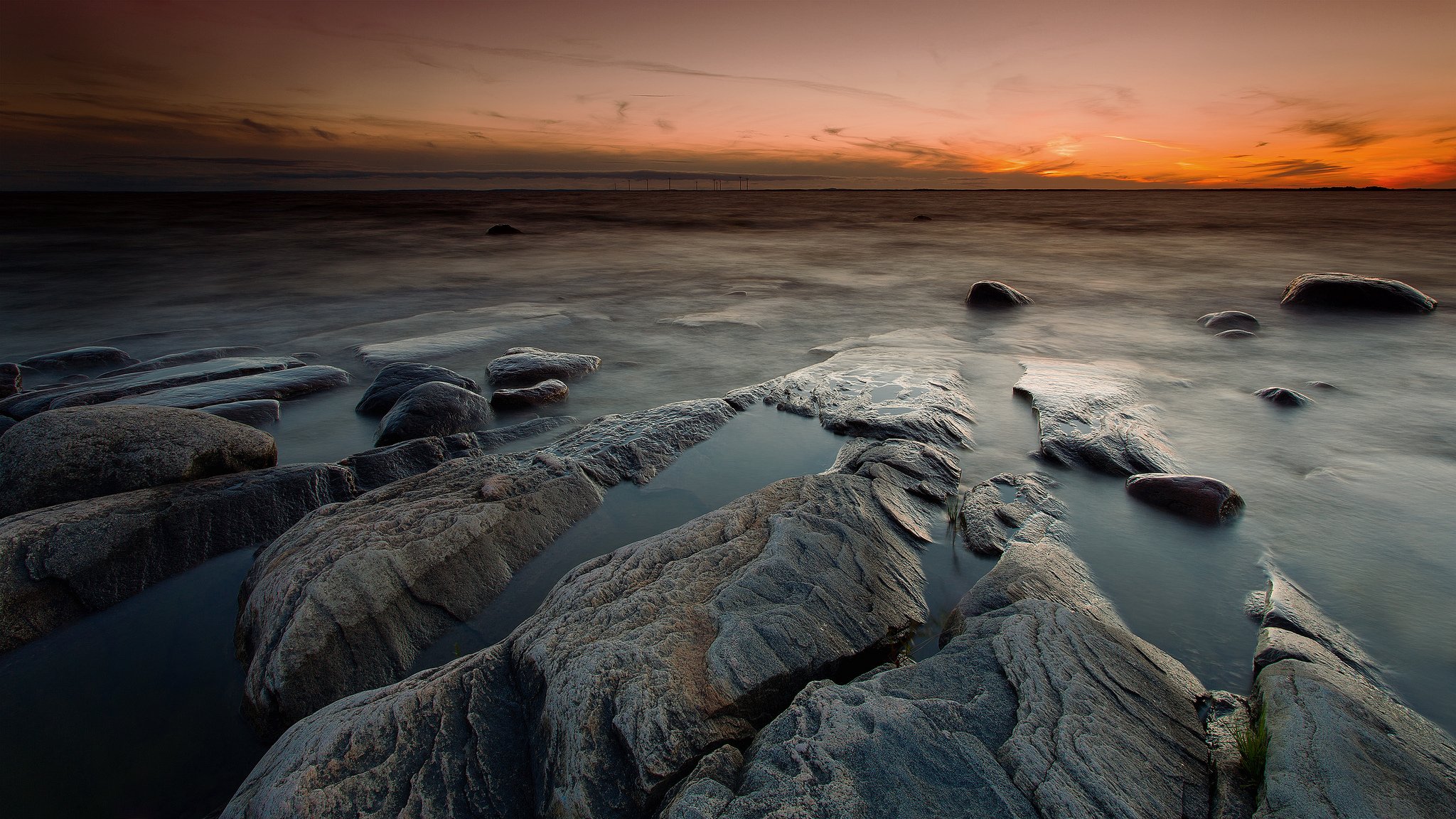 meer strand steine sonnenuntergang