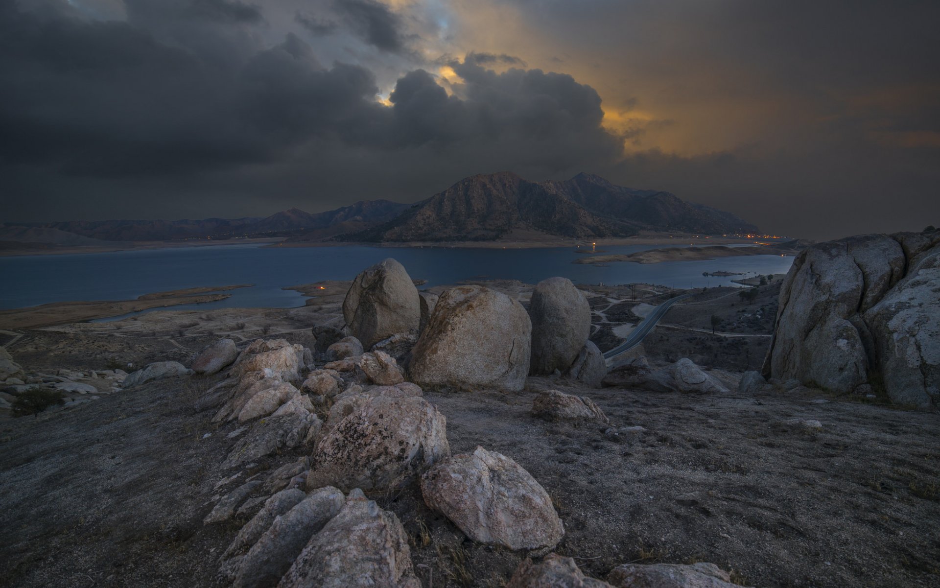 mountain stones road lake clouds twilight light