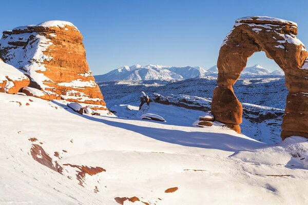 Arch of rocks on a winter background