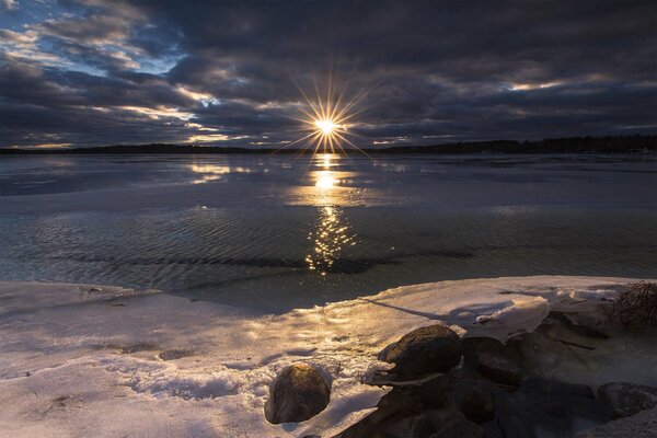 The sun comes out in the afternoon and some of the ice on the shore melts