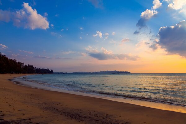 Evening beach. Clouds and calm