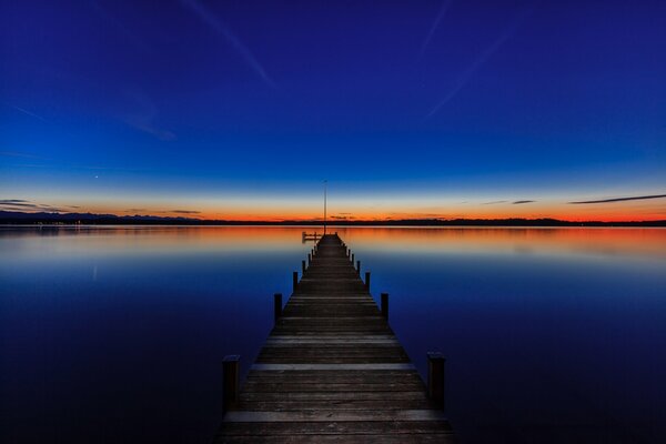 Sunset on Lake Starnberg at the pier in Bavaria