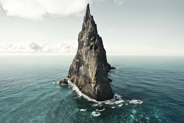 Nature of Australia, a rock in the ocean water on an island