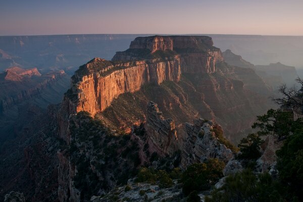 The deep canyon is illuminated by the bright sun