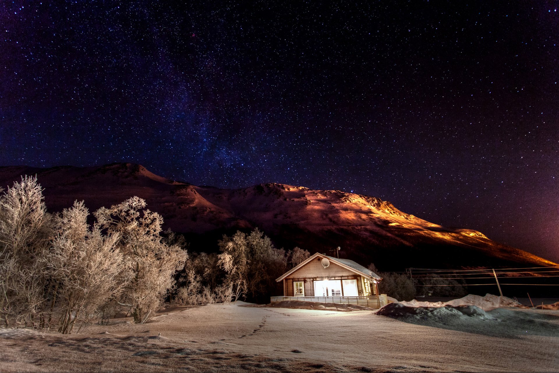 mountains winter nature snow night sky stars house house light tree