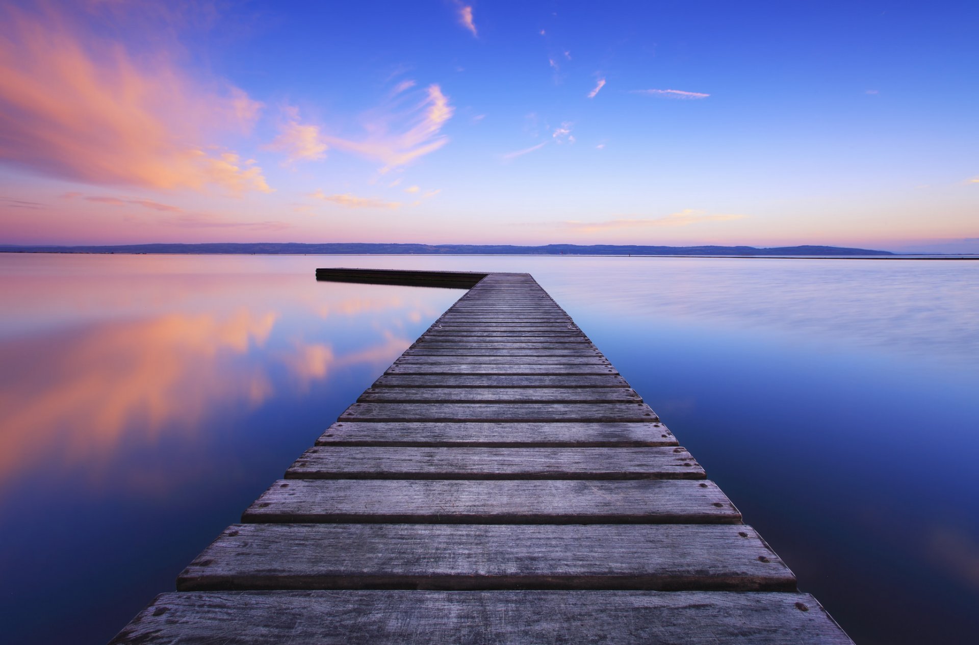 united kingdom england lake water surface of wood bridge night sky blue clouds reflection