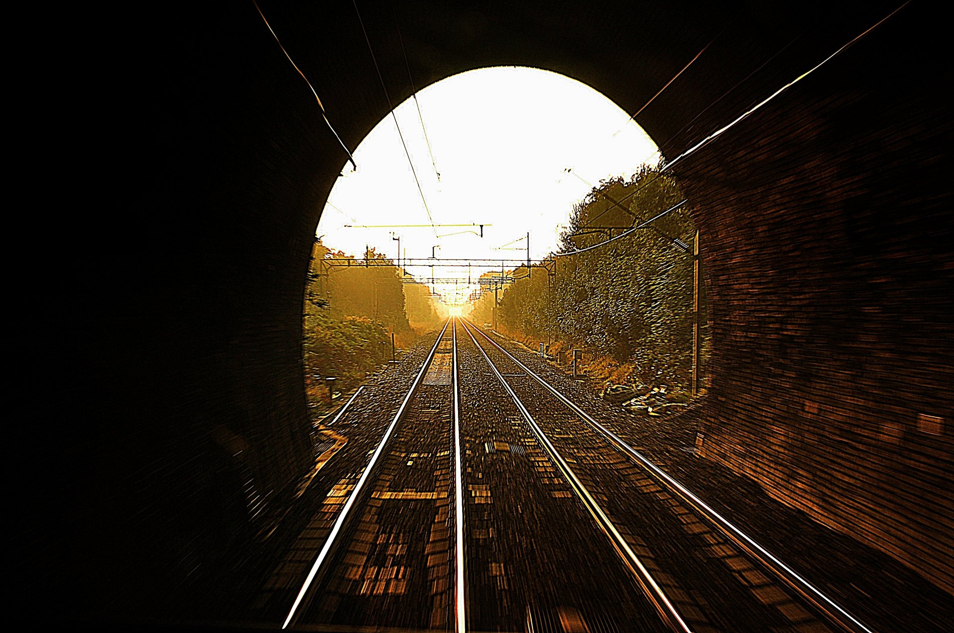 tunnel railroad rails sun light