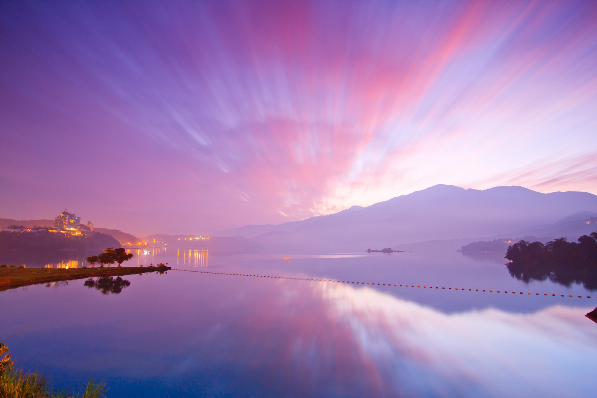 ocean water sky grass mountain tree house clouds light