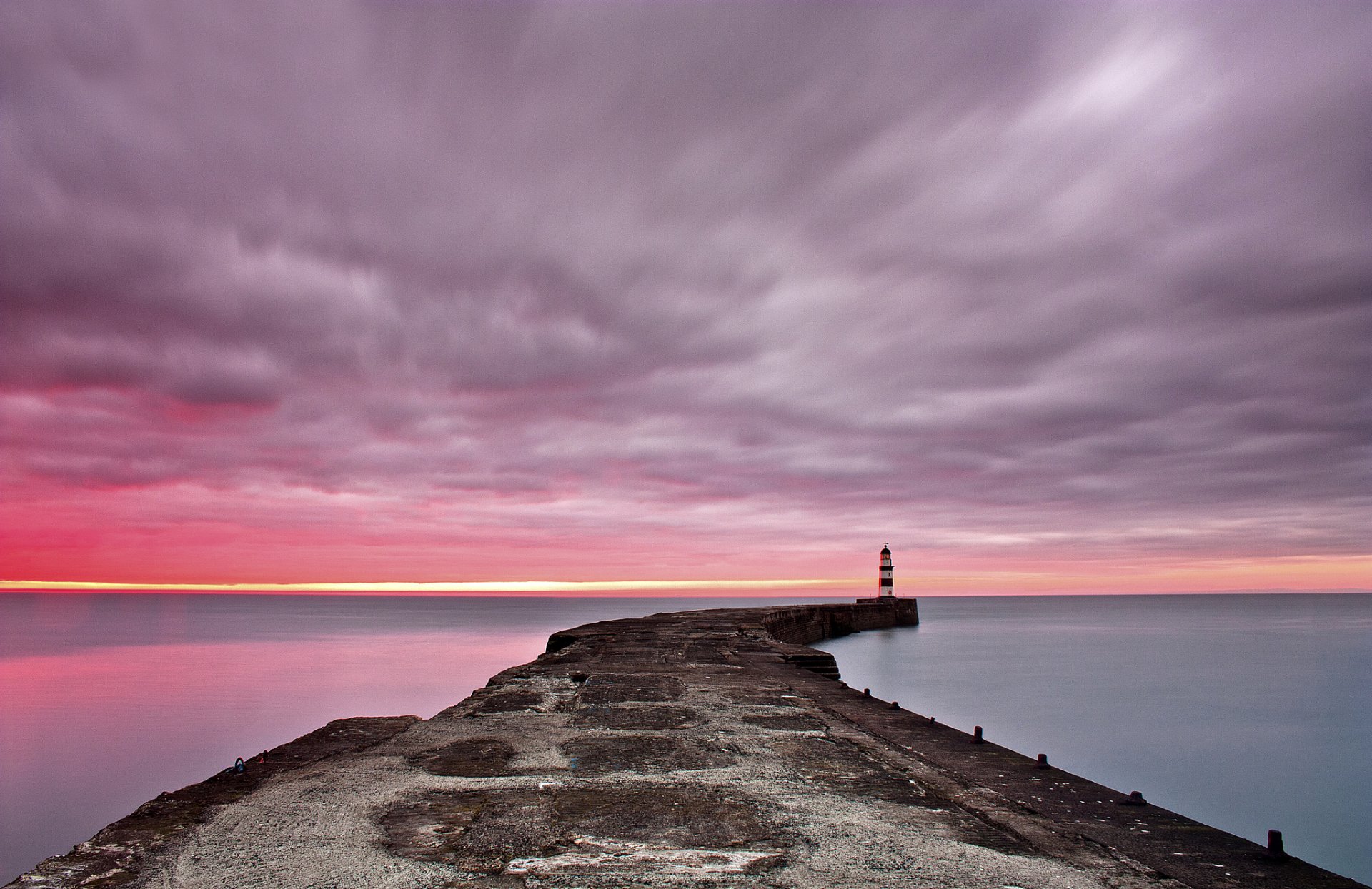 mar muelle faro amanecer