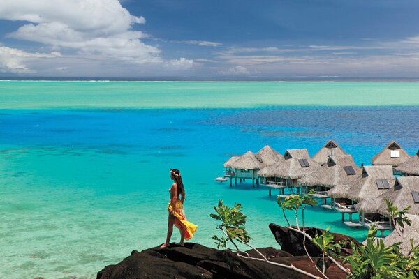 Summer landscape girl on the background of turquoise water