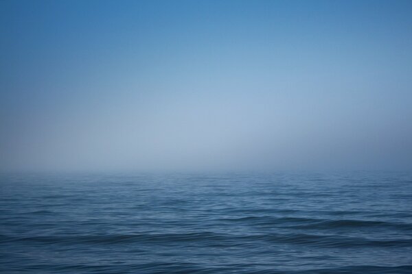 White fog over the blue sea