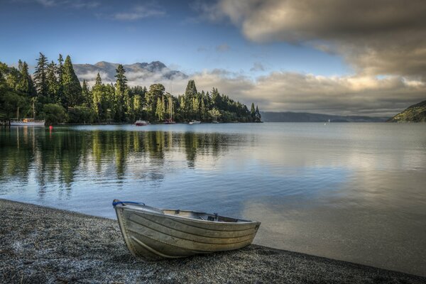 Lakes of New Zealand, boat on the lake shore, lake views