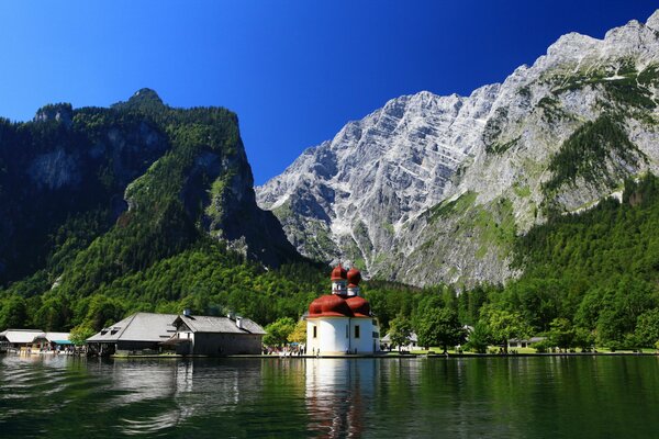 Church on a lake among the Bavarian Alps