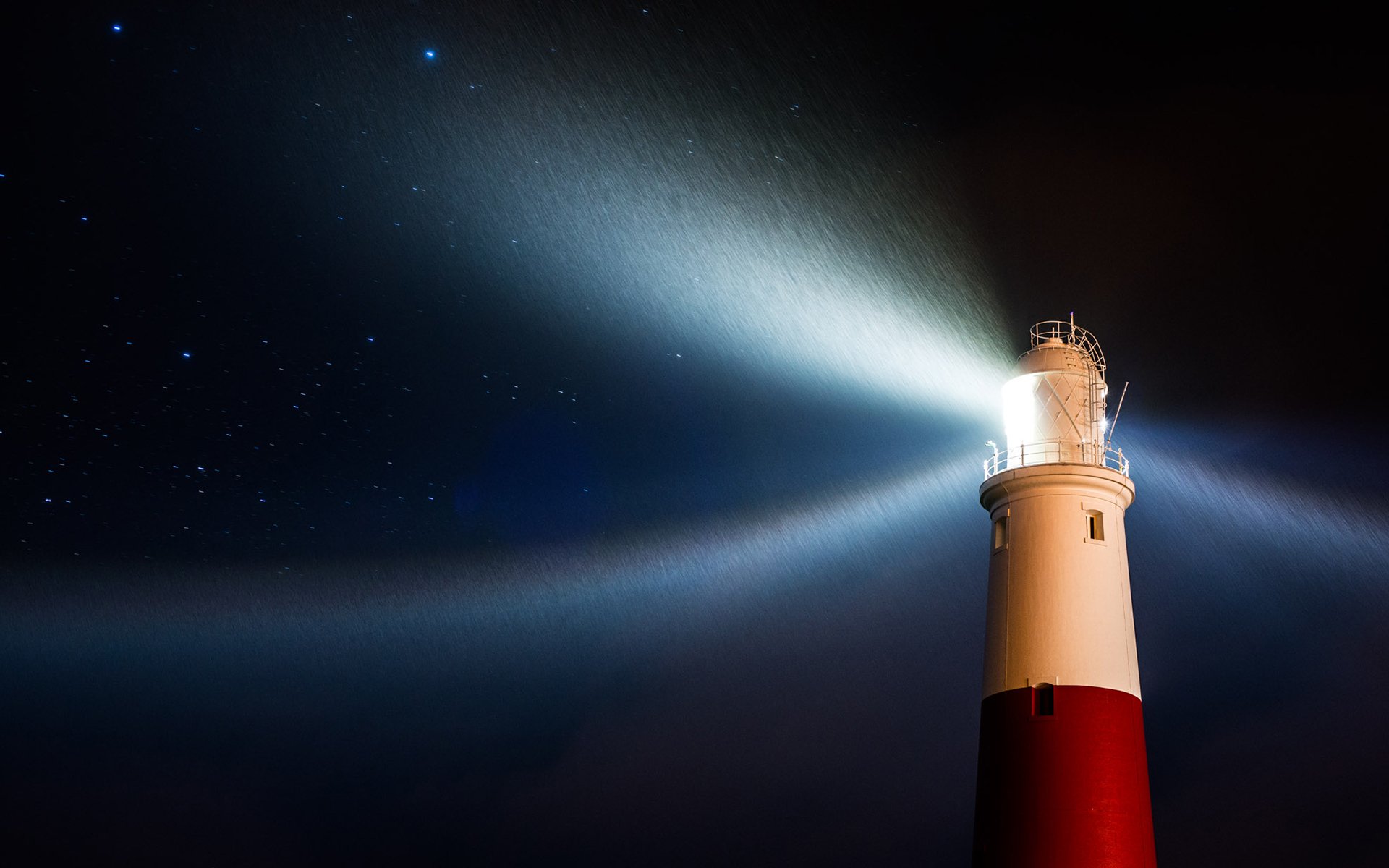 lighthouse night light star rain