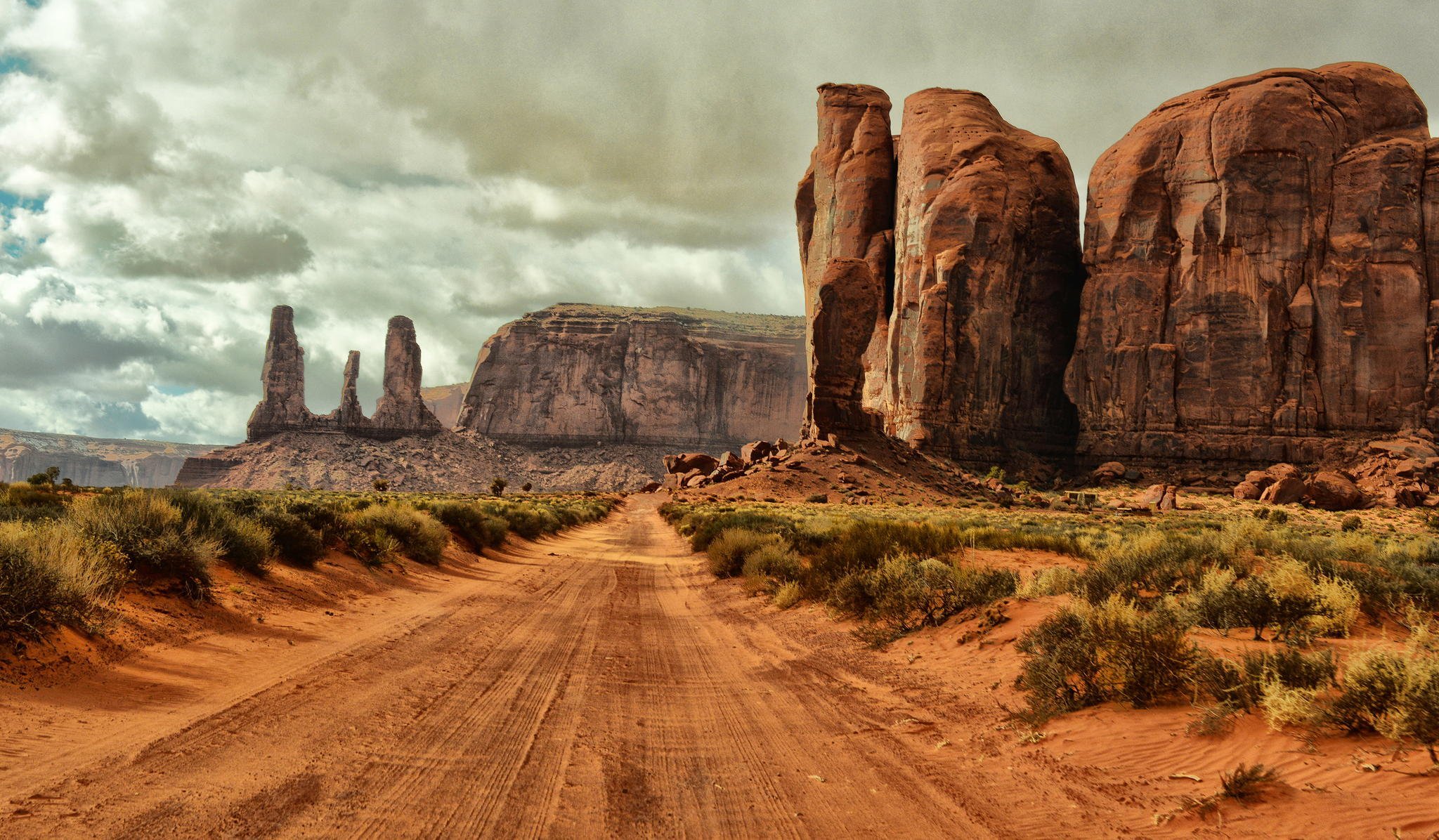 arizona monument valley usa monument valley straße boden sand felsen sträucher wolken