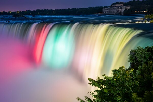 Waterfall with fog and colorful water