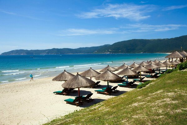 Straw umbrellas on the sea coast