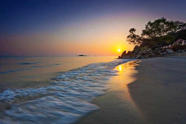 Golden sunset on the coast of the Strait of Malacca