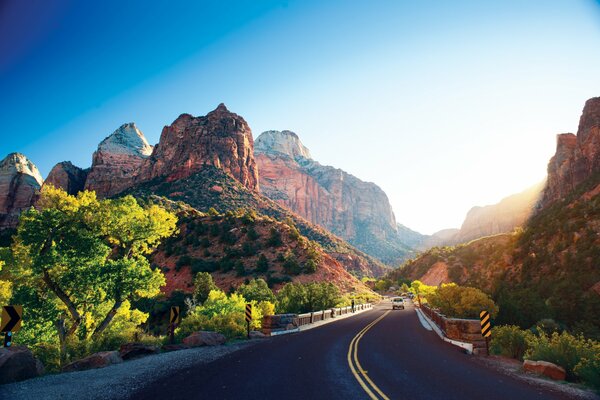 A winding road among mountains and trees