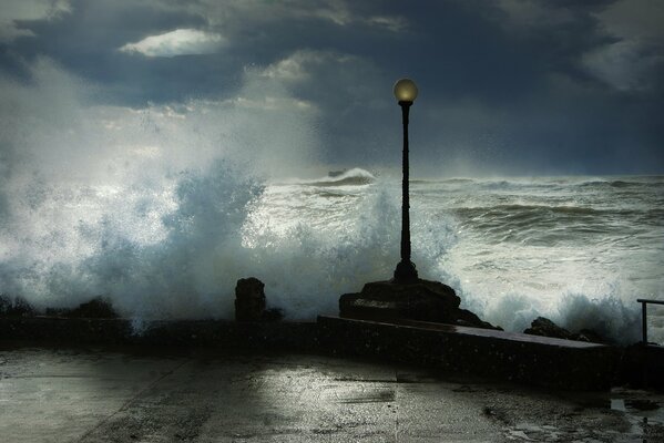 Strong waves break on the embankment